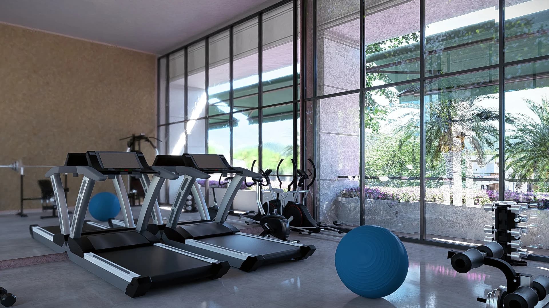 Gimnasio con ventanales panorámicos y vista al jardín