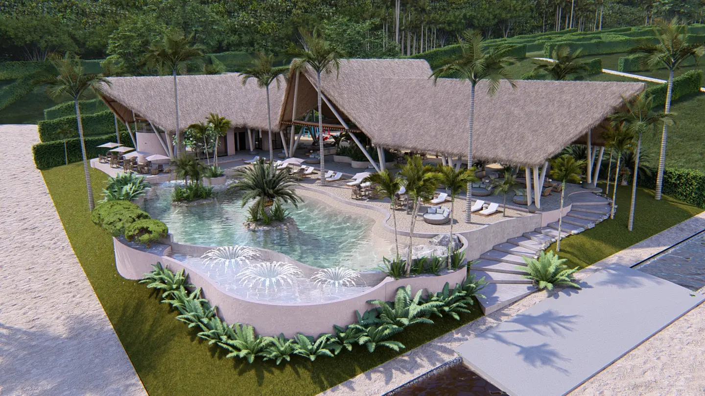 Club house con techos de palma y piscina vista desde el aire