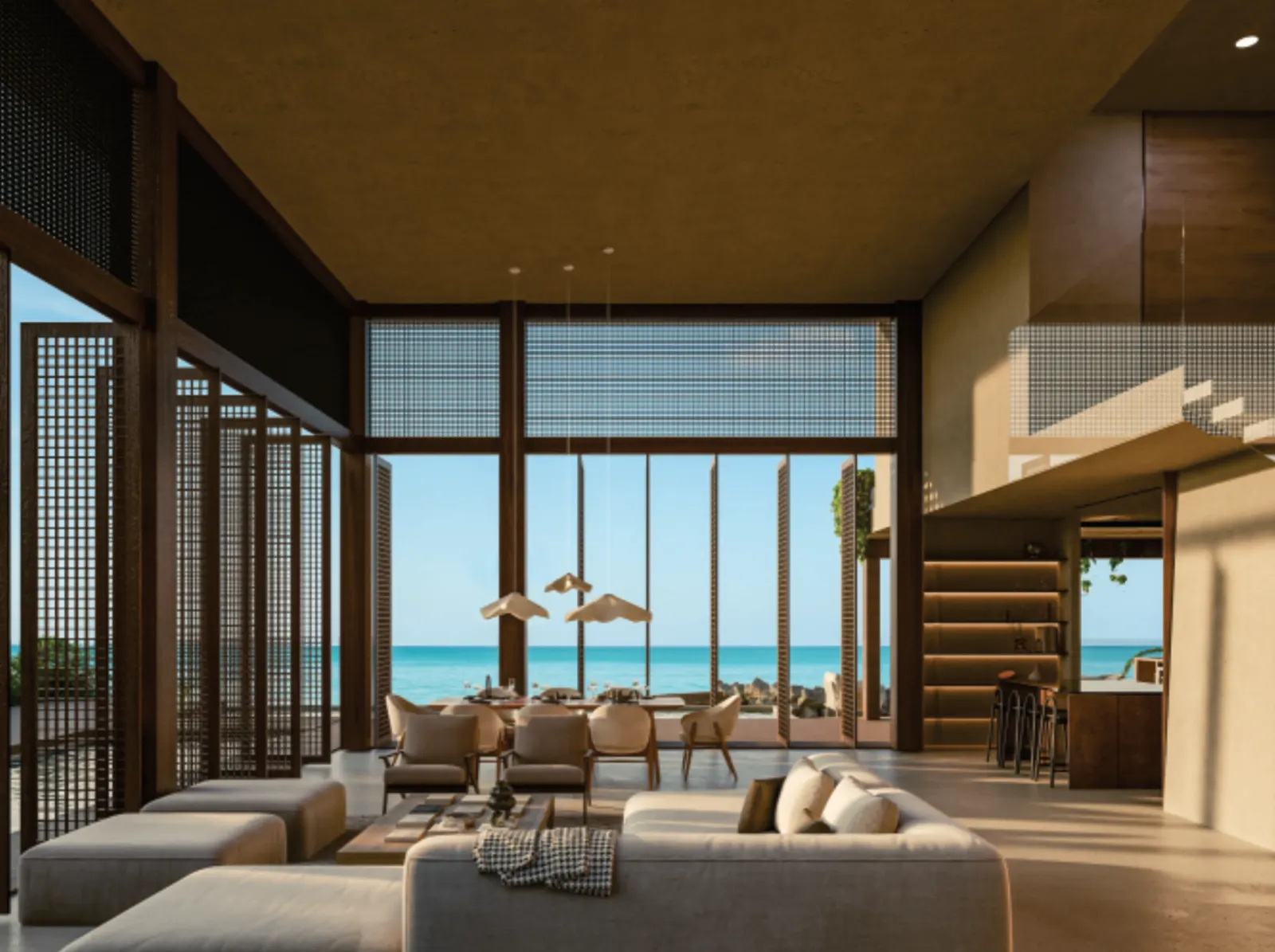 Sala de doble altura de la Casa Teka abierta al mar